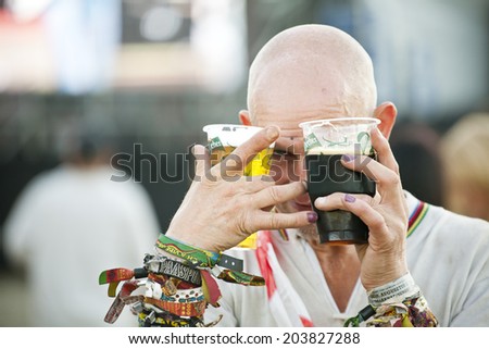 Budapest, Hungary - August 13th 2010: A drunk adult man looking at camera in the main stage area of Sziget Festival