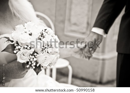 Emotions: Love Feelings Wedding Moments A couple of adults just married. Close up of wife and husband holding hands