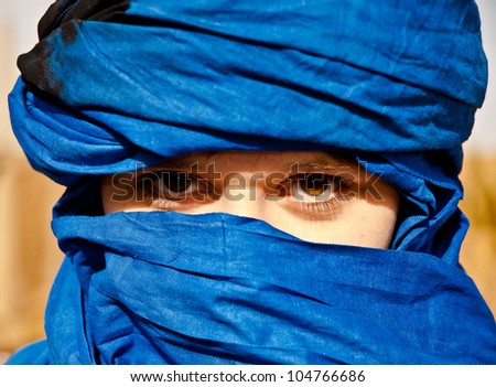 Tourist girl with typical nomad head cover - blue turban