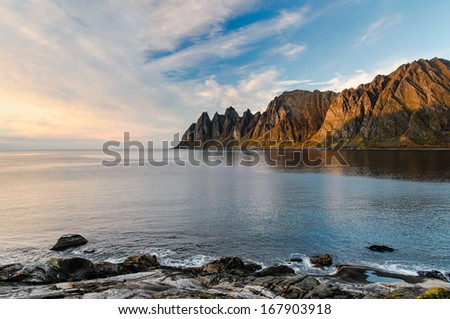 Devil\'s teeth sharp cliffs at sunset in Senja island, Norway