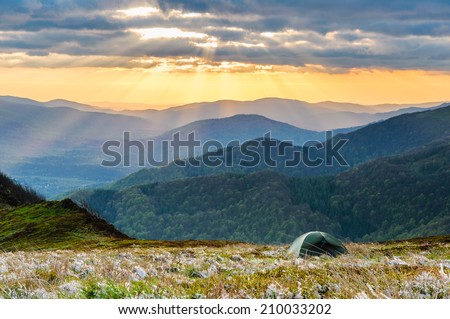 Wild camping on the ridge of Bieszczady national park while having an amazing view on sunset