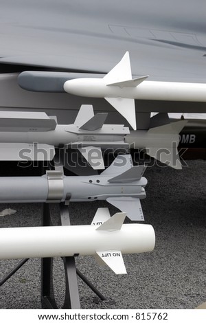 Military missiles on a display rack in BW