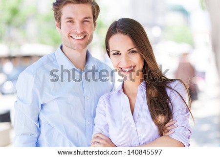 Business couple outdoors