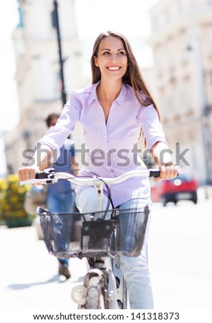 Woman riding a bike in the city