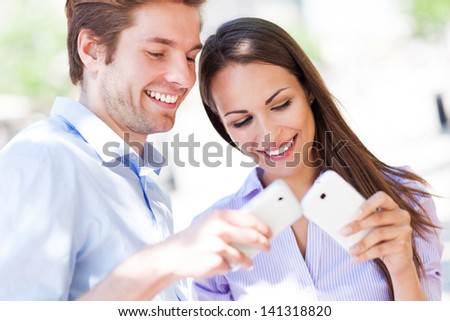 Young people with mobile phones