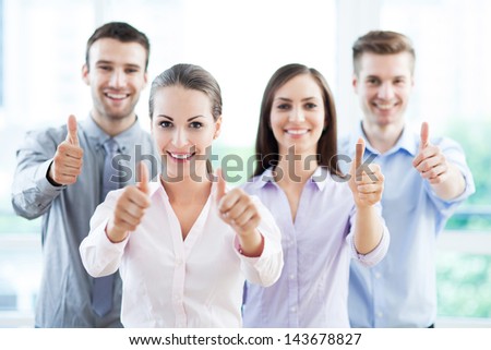 Coworkers showing thumbs up