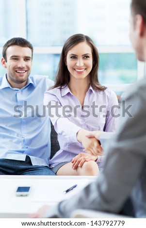 Couple meeting with financial adviser