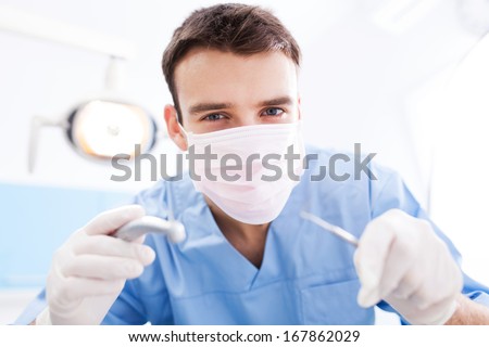 Dentist Holding Dental Tools Dentist Holding Dental Tools