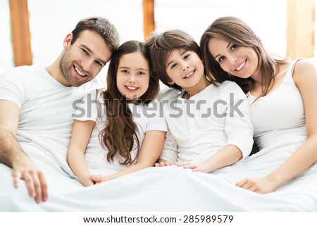 Young family in bed