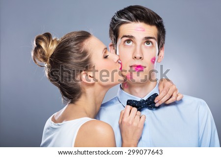 Young woman kissing man