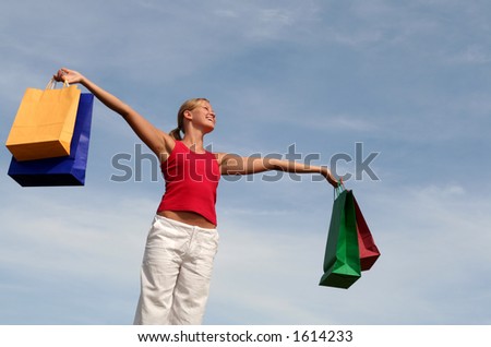 Happy woman  with shopping bags