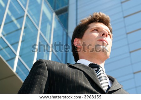 Businessman outside a modern office building