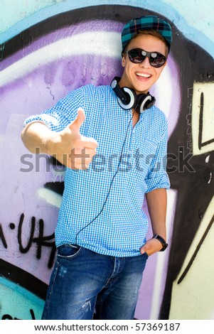 Young man with thumbs up