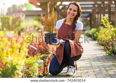 Smiling employee in garden center