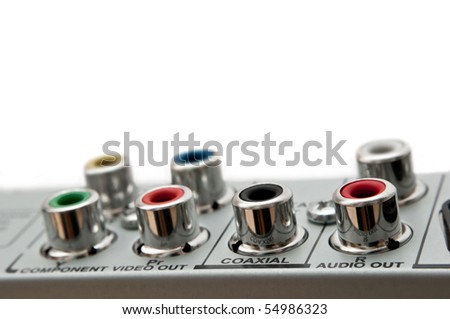 Close up capturing audio visual sockets on the rear of an electrical device. White background.