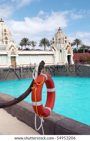 Life buoy on the background of swimming pool in the water park