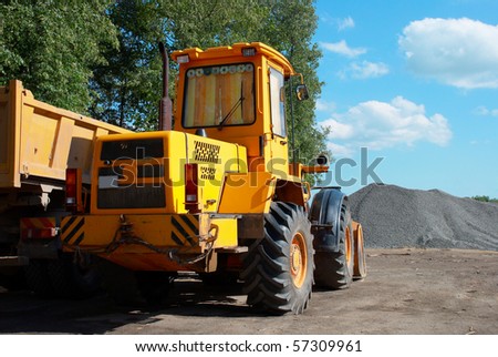 Yellow front loader made in the Republic of Belarus