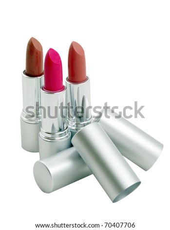 Three open lipsticks in metallic tubes isolated on a white background