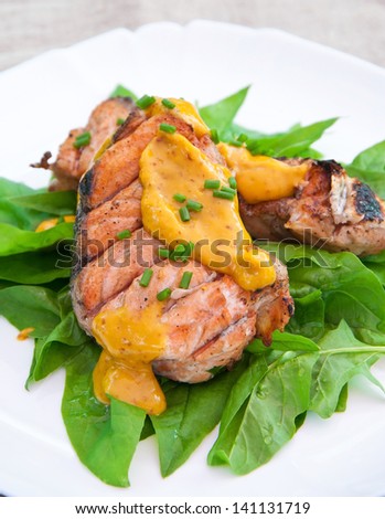 grilled salmon on spinach pillow with orange-mustard sauce