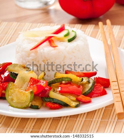 Plate of vegetable fried rice and chopstick