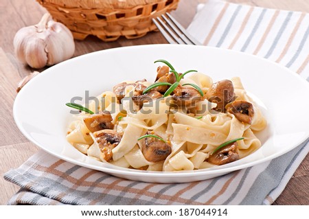 Vegetarian dish with tagliatelle and mushrooms