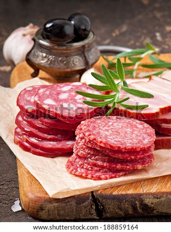 Assorted deli meats, rosemary and pepper