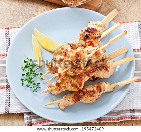 grilled chicken on bamboo skewers