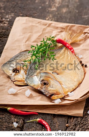 Vomer smoked fish on the wooden background