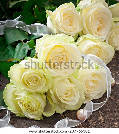 White roses on the wooden backgrounds