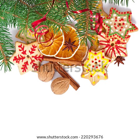Christmas cookies, spices and spruce branches isolated on white background