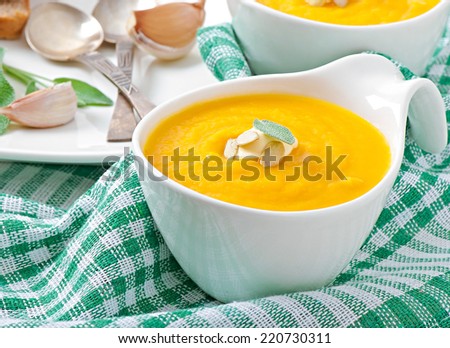 Cream of pumpkin soup with sour cream sauce