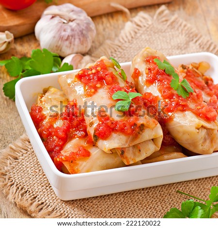 Stuffed cabbage with tomato sauce decorated with parsley