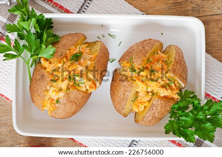 Baked potatoes stuffed with minced chicken and carrots