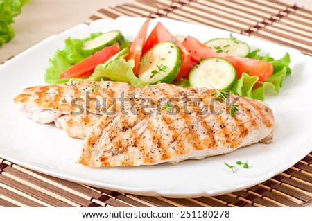 Grilled chicken breasts and vegetables