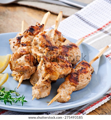 Grilled chicken on bamboo skewers