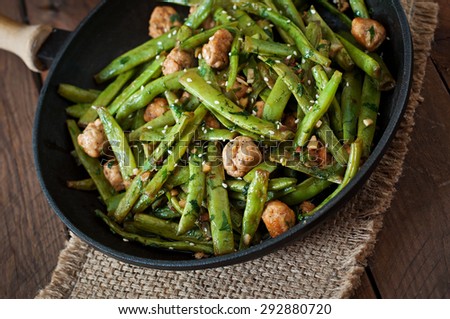 Green beans fried with chicken meatballs and garlic Asian style