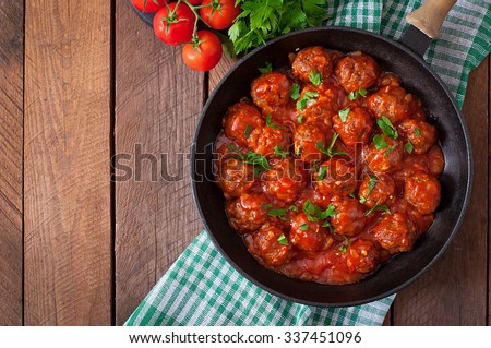 Meatballs in sweet and sour tomato sauce. Top view