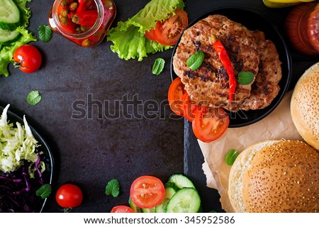 Sandwich hamburger with juicy burgers, cheese and mix of cabbage. Top view