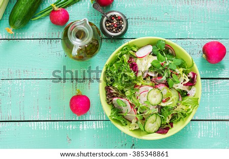Fresh salad of cucumbers, radishes and herbs. Top view