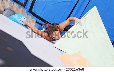 Female climber on artificial climbing wall