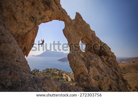 Rock climber falling of a cliff while lead climbing. Kalymnos Island, Greece