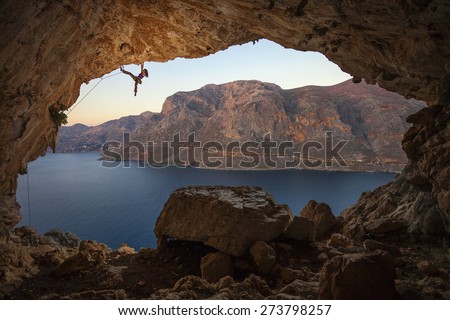 Female rock climber on a cliff in a cave at Kalymnos, Greece