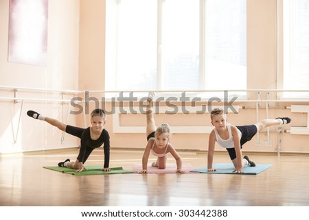 Young dancers warming up at ballet class