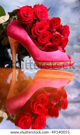 Composition with red roses and pink female shoe on sky background
