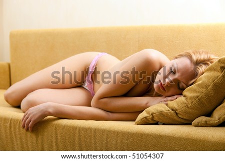 Young pretty woman sleeping on couch