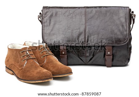 Pair of winter men boots and messenger bag isolated over white