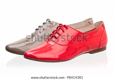 Patent leather women shoes against white background