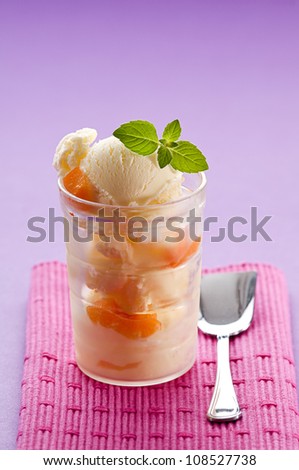 Fresh apricot ice cream in glass close up