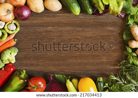 Vegetables on old wooden background overhead close up shoot