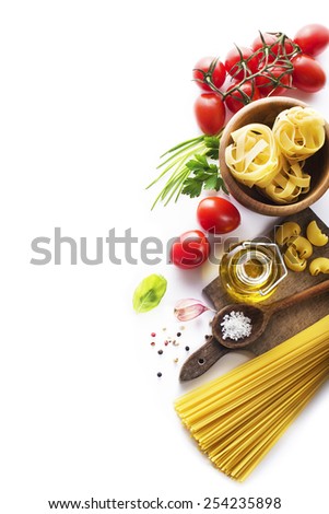 Raw Pasta with ingredients on white background